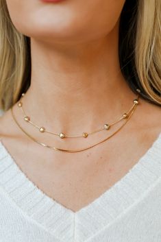 Showcase your sweeter side when you wear the Aria Gold Heart Layered Chain Necklace! This trendy necklace features two layers of gold chains with hearts. Style the Aria Necklace with any outfit to instantly upgrade your look! Gold Plated Layered Hearts Lobster Clasp with Extender Layer 1 | Length 7" Layer 2 | Length 6.5" Extender | Length 3" Gold Heart-shaped Layered Necklace With Clavicle Chain, Trendy Double Chain Heart Necklace, Trendy Heart-shaped Double Chain Necklace, Trendy Gold-tone Layered Necklace, Gold Heart Pendant Layered Necklace, Gold Layered Heart Pendant Necklace, Gold Heart-shaped Layered Necklace With Delicate Chain, Necklace Trendy, 7 Layer