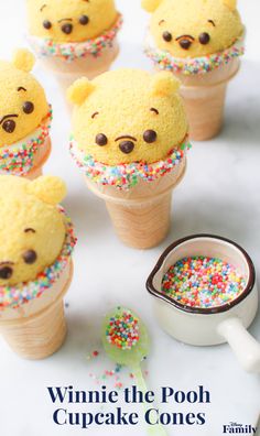 some cupcakes with frosting and sprinkles in the shape of bears