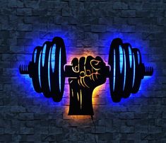 a lit up barbell with a fist on it