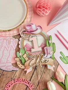 a table topped with lots of pink and white items