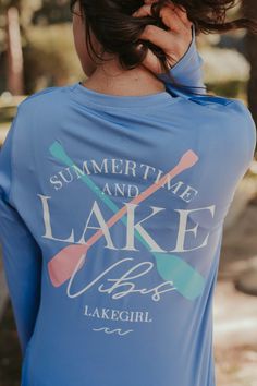 the back of a woman's blue shirt that says, summertime and lake life is lakegirl