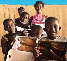 a group of children holding up pictures and smiling at the camera, with text overlaying them