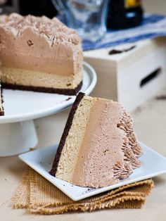 two pieces of cake sitting on plates next to each other