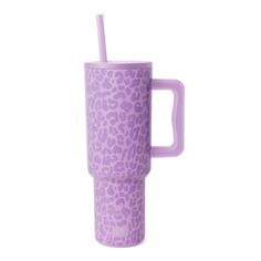 a purple cup with a straw in it and a leopard print pattern on the side