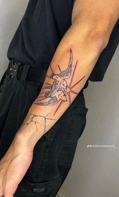 a man with a tattoo on his arm