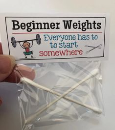 someone is holding some toothpicks in their hand and there is a sign that says, beginner weights everyone has to start somewhere