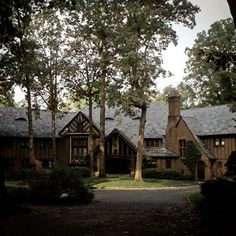 a large house surrounded by trees and bushes