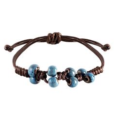 PRICES MAY VARY. UNIQUE CERAMIC BEADS IN OCEAN TONES: This handcrafted bracelet features ceramic beads in beautiful shades of ocean blue, speckled with unique patterns that resemble the sea's natural textures. Each bead is meticulously placed to evoke the tranquility of ocean waves. ADJUSTABLE LEATHER CORD: The robust leather cord is designed for longevity and comfort, featuring an adjustable knot that allows for a customized fit for any wrist size. PERFECT FOR LAYERING OR SOLO WEAR: Whether wor Leather Cord Jewelry, Jump Ring Jewelry, Boho Style Bracelets, Hippie Summer, Summer Beach Jewelry, Fishing Bracelet, Leather Cord Bracelets, Adjustable Knot, Cord Jewelry