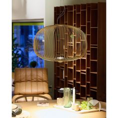 a wooden lamp hanging over a dining room table