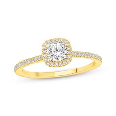 a yellow gold engagement ring with diamonds