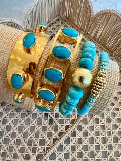 Discover the exquisite Byzantine Turquoise Cuff, a remarkable testament to craftsmanship. This bracelet is lovingly handcrafted in the USA by a talented mother-daughter duo from Handmade Chakarr Jewelry. It features five stunning turquoise stones, delicately cradled in bezel settings and adorned with a gleaming gold-plated finish. Made in the USA. Turquoise Stackable Bangle Jewelry, Stackable Turquoise Bangle Jewelry, Artisan Turquoise Cuff Bracelet With Natural Stones, Turquoise Artisan Cuff Bracelet With Natural Stones, Artisan Turquoise Beaded Bangle Bracelet, Artisan Turquoise Beaded Bangle Bracelets, Elegant Turquoise Cuff Bracelet With Gemstone, Turquoise Natural Stone Cuff Bangle, Turquoise Bangle Cuff Bracelet With Natural Stones