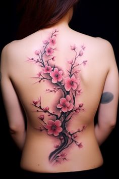 a woman's back with pink flowers on it