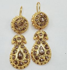 Georgian Antique 2.90 Ct Rose Cut Diamond Sterling Silver Drop Dangle earring for women  Metal: Sterling Metal Purity: 925 Metal Wt: 9.00 gram Diamond Type: Natural Rose Cut Diamond  Diamond Color: Tinted Brown  Diamond Clarity: I1-I2  Diamond-Cut: Good Diamond Shape: Pear & Round  Diamond Wt: 2.90 Ctw Product Color: Oxidized Black and Gold Rhodium Plated on Sterling Silver Classic Gold Earrings With Rose Cut Diamonds, Classic Hand Set Yellow Gold Earrings, Classic Rose Cut Diamond Drop Earrings, Classic Hand Set Drop Earrings, Classic Drop Earrings With Rose Cut Diamonds, Anniversary Yellow Gold Earrings With Rose Cut Diamonds, Classic Hand Set Dangle Earrings, Classic Gold Earrings Hand Set, Gold Drop Earrings With Rose Cut Diamonds