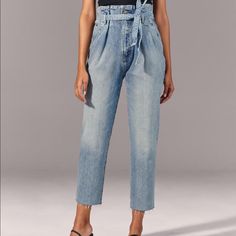 Nwt Ultra High Rise Denim. The Perfect Mom Jean. Very Feminine Fit, Definitely Shows Off Your Assets! Features Cropped Raw Hem, Zip Front With Top Button Closure, Classic Tapered Straight Leg Styling, Medium Light Wash, Belt Included. Just Love The Amazing Fit And Feel71% Cotton, 28% Lyocell, 1% Elastane. Approximate Measurements: Size 26/2us Waist 26”, Rise 12.75”, Inseam 26.5”. No Trades Ever Mom Jean, High Rise Denim, Cropped Denim, Denim Jean, Jeans Denim, Abercrombie Fitch, Mom Jeans, Denim Jeans, Paper Bag