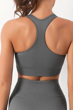 Gray Zipped Ribbed Racerback Sports Bra Solid Activewear With Zipper Closure For Gym, Solid Activewear With Zipper Closure For Workout, Solid Color Activewear With Zipper Closure For Gym, Gray Racerback Sports Bra With Built-in Bra, Supportive Gray Sports Bra With Built-in Bra, Sporty Gray 4-way Stretch Sports Bra, Compressive Gray Sports Bra, Gray Compressive Seamless Sports Bra, Active Top