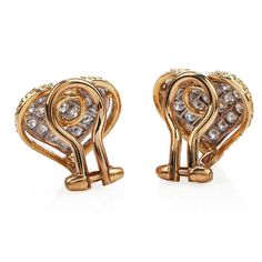 "Buccellati brings the \"everyday wear\" into a Luxury level with these delicate Earrings! Crafted in Solid 18K Yellow & White Gold, These Heart Motif earrings are the perfect fit for a modern woman, who likes to shine everywhere she goes! With a Cluster Pave set Design of 38 Round Cut Diamonds with a total carat weight of 0.60 cts, G-H color, VS clarity. Both Earrings are in Excellent condition, and they have Clip On backs for Non-pierced Ears, Weight: 5.1 Grams Measurements: 12 mm x 14 mm Heart Clip, Engagement Ring Photos, Heart Motif, Yellow Gold Wedding Band, Delicate Earrings, Jewelry Business, Gold Engagement, Gold Heart, Vintage Diamond