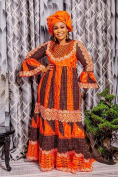 Description: This magnificent Anakara (Wax print ) African dress is perfect for any occasion you want to look your best. its a FULL DRESS WITH HEADWRAP ONLY. Important Note: THIS WAX PRINT NNEXT TO THE STYLE WE POSTED  WILL  BE USE WITH ORANGE BROIDERIE FOR THIS STYLE   You can always request to see other color wax print after you place your order by sending us a message along with your order. PROCESSING: We usually take 3-4  BUSINESS DAYS to make the dress. SHIPPING: We use DHL shipping with tracking and text update. (3 to 5 days) SIZING: What we need from you We have a sizing Chart in the images. Scroll to the right. (Providing your desire measurements for proper fitting ) BUST WAIST HIP SHOULDER SLEEVE LENGTH ARMHOLE Shoulder to waist Length of dress from shoulder to hem Length of skirt Orange Floral Print Dress For Wedding, Red Printed Wedding Dress, Orange Printed Party Dress, Elegant Orange Printed Maxi Dress, Black Maxi Dress With Batik Print, Traditional Orange Long Sleeve Dress, Printed Maxi Length Dress, Traditional Long Sleeve Orange Dress, Red Long Sleeve Dresses With Batik Print