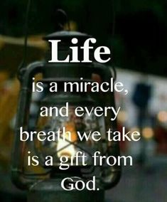 a lantern with the words life is a miracle and every breath we take is a gift from god