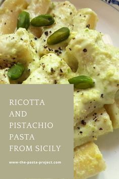 ricotta and pistachio pasta from scily on a white plate with blue border