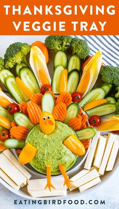 a turkey shaped veggie tray with carrots, broccoli and cucumbers