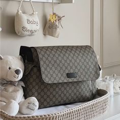 a teddy bear sitting next to a purse