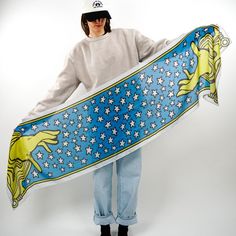 Two hands reach from the ether, surrounded by stars in "Mystic". Magical yellows and vibrant blues make this scarf pop! Conjure up a stunning outfit with this sorcerous scarf.  Inspiration: Ilsée : Princesse de Tripoli, 1897 - Soft cotton blend - Fan favorite 72" x 18" size - Versatile styling options - Timeless book-inspired design - Perfect for all-season wear Scarf Inspiration, Star Scarf, Yellow Accessories, 2024 Style, Church Design, Stunning Outfits, Elegant Accessories, Blue And Yellow, Book Lovers Gifts