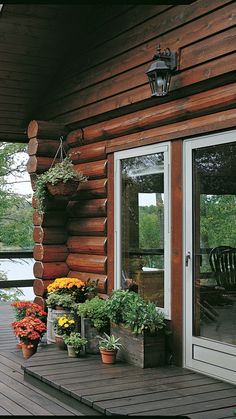 a porch with potted plants on it