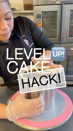 a woman in black shirt making cake on top of a table with words level up