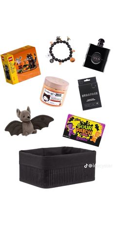 an assortment of halloween items including a bat, bracelets and other items on a white background