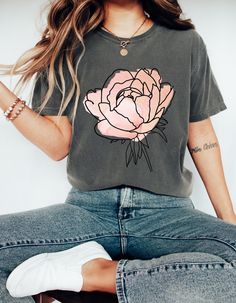 Introducing our Elegant Pink Rose Graphic Shirt - a wearable masterpiece designed to capture the essence of delicate beauty and timeless grace. Crafted for those who appreciate the finer things in life, this shirt is a true celebration of femininity and nature's elegance. 🌹 Design Details: 🌸 A stunning, intricately detailed pink rose adorns the center, its petals delicately illustrated to showcase nature's artistry. 💖 The soft pink hue adds a touch of romance, making it a perfect choice for a Graphic Tees 2023, Amazon Free People, Free People Aesthetic, Trending Tees, Prime Deals, 50 Is Not Old, Rose Graphic, Women's Graphic Tees, Amazon Fashion Finds