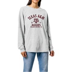 a woman wearing a texas a & m long sleeve t - shirt