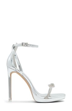 A jewel-encrusted bow adds a dose of glam to the vamp strap of a party-ready sandal lifted by a subtle platform and soaring stiletto heel. 4 1/2" heel; 1/2" platform Adjustable ankle strap with buckle closure Synthetic and textile upper, lining and sole Imported Glamorous Silver Heels With Bow, Glamorous Open Heel Heels With Bow, Sparkling High Heel Sandals For Formal Occasions, Glamorous Sandals With Wrapped Heel For Gala, Silver Heels With Bow For Formal Occasions, Elegant Silver Heels With Bow, Glamorous Bow Sandals For Night Out, Glamorous Formal Sandals With Bow, Ankle Strap Sandals With Bow For Cocktail