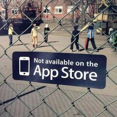 there is a sign on the fence that says not available on the app store,