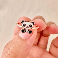 Cute Panda Ring , Rose Gold Panda Adjustable Ring, Panda Open Ring, Animal Style Open Size Ring, Skinny Open Ring, Gifts for Her/Girls Minimalist Panda Design, this ring is truly timeless and perfect for everyday wear. - - D E T A I L S - - * Made of Brass and 14k Rose Gold Plated ★Size is adjustable, Minimum Diameter: 17 mm, Maximum Diameter: 19mm ★Band Size: 1.2mm, Panda Icon size: 9mm x 9mm * Hypoallergenic and nickel free ★It comes in beautiful and elegant packaging and is ready for gifting! Cute Adjustable Midi Promise Rings, Cute Adjustable Nickel-free Rings, Adjustable Cute Nickel-free Rings, Adjustable Nickel-free Cute Rings, Cute White Rings For Gifts, Cute Adjustable Rings For Promise, Cute Adjustable Open Ring Jewelry, Cute Adjustable Promise Ring, Cute Open Ring For Promise