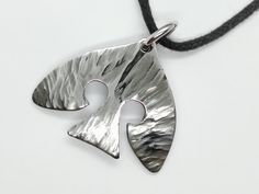 "Hand forged stainless steel pendant in the shape of a raven. This amazing celtic raven necklace would make a wonderful gift or a great keepsake. During check out you might choose between the two options for around the neck: >black cotton thread for around the neck with adjustable length OR >stainless steel ball chain 50 cm long. The pendant is aprox 1. 30'' /33mm long and 1.56\"/40mm wide. Gift box is included. The raven charm necklace is made of high quality stainless steel ( hypoallergi Hand Forged Silver Viking Jewelry, Celtic Raven, Crow Pendant, Crow Necklace, Nordic Jewelry, Fork Bracelet, Raven Pendant, Raven Necklace, Hammered Necklace