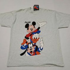 Mickey Mouse Florida Disney Gray Men’s Double Sided T-Shirt New With Tags!!! Yellow Stains From Storage On Both Sides Of T-Shirt And By Collar Size - Xl Mickey Mouse Short Sleeve Top For Fans, Short Sleeve Mickey Mouse Tops For Fans, Fun Short Sleeve Mickey Mouse Shirt, Disney Cotton Tops For Streetwear, Fun Mickey Mouse Short Sleeve Shirt, Retro Mickey Mouse Tops For Disney Fan Events, Fun Mickey Mouse Top For Streetwear, Fun Mickey Mouse Tops For Streetwear, Mickey Mouse Cotton Tops For Streetwear