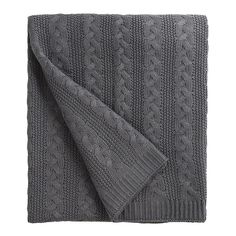 a gray blanket with cable knits on it