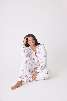 Celebrate the season in style with this charming 'Candy Cane Lane' collared PJ set, featuring a delightful pattern of holiday dogs donning festive red hats. The classic collared top exudes a timeless elegance, while the soft fabric ensures comfort during cozy nights. With its cheerful design, this pajama set brings a playful touch to your winter wardrobe, making it ideal for holiday gatherings, gift giving, or simply enjoying a festive movie night. Embrace the joy of the season with this adorabl Winter Loungewear, Candy Cane Lane, Red Cocktails, Short Kaftan, Tie Waist Pants, Flannel Pajama Sets, Collared Top, Dog Holiday, Loungewear Set