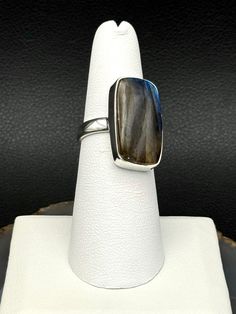 *RING / SIZED (SKU) FEATURES: entirely sterling silver simple bezel setting smooth labradorite rectangle (E4= highest possible quality for this price point) THE STONE: LABRADORITE• intuition• confidence• magic THE METAL: SILVER- moon energy• love• intuition• well-being TIMEFRAME: IN STOCK, WILL SHIP WITHIN 5 BUSINESS DAYS For more information, please call or text us at (828) 299-4751 Moon Energy, Zodiac Cards, Bohemian Bridal, Dangle Hoop Earrings, Chains Necklaces, Silver Moon, Best Candles, Bezel Setting, Well Being