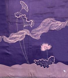 a purple cloth with flowers and leaves on it