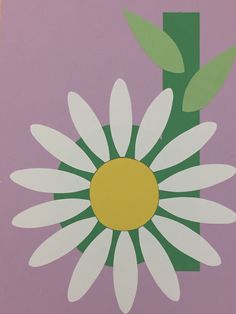 an image of a flower painted on the side of a purple wall with green leaves