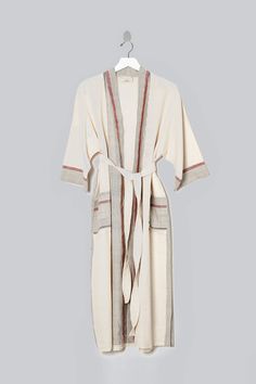 Crafted on the coast of Turkey, our Ivory Cherry Tribeca Long Robe is hand loomed using traditional techniques and woven with 100% premium Turkish cotton. Similar to a Turkish towel, it is highly absorbent, lightweight, eco-friendly, and quick to dry. Lounge in your robe by the sea or layer it over a lightweight dress. Experience how your robe becomes softer and better with each and every wash! Care - Machine wash cold. Tumble dry low or line dry. Sizing - Small: 46" L, ~25" W , Medium: 46" L, ~ Bed Headboard Storage, Lightweight Dress, Hand Loom, Turkish Towels, By The Sea, Traditional Techniques, The Coast, Ethical Fashion, Handmade Natural