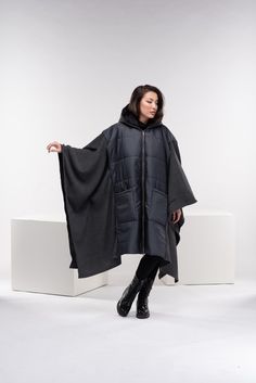 "Stay warm while staying fashionable with this unique puffer jacket poncho with oversized pockets and zipper closure, and a large cozy hood. This maxi quilted coat has a street vibe and is unisex for all body types. You can wear it in different ways, go all the way as a poncho, or halfway through. Made from two fabrics - puffer quilted fabric and wool knitted fabric, and while the textiles are different, there is a relationship in the shapes. A good jacket or coat can really make an outfit. It's the finishing touch before walking out the door. ◼️FIT This puffer jacket is a one-size design. It is roomy and oversized and it fits all our sizes from XS to 4XL. ◼The model in the picture is wearing the color Dark Gray. ◼️FABRIC ◾polyester quilted fabric with viscose lining, knitted acrylic wool Oversized Hooded Parka For Outdoor, Oversized Hooded Outerwear For Outdoor, Oversized Parka With Adjustable Hood For Cold Weather, Oversized Hooded Outerwear For Cold Weather, Oversized Hooded Puffer Jacket For Fall, Oversized Winter Poncho For Cold Weather, Oversized Puffer Jacket With Pockets For Outdoor, Oversized Winter Poncho, Oversized Hooded Jacket For Cold Weather