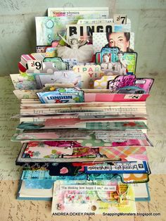 a stack of magazines sitting on top of a table