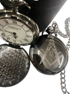 Masonic Luxurious Gift in Presentation Case FREE ENGRAVING UP TO 6 WORDS ON THE BACK! Gloss Black coated  Quartz Pocket Watch  Full Hunter Case includes chain and gift case. The black coated steel front of this Full Hunter features the Masonic emblem precision diamond cut - the detailing is excellent. A Luxury Vault exclusive with limited supplies at this price - If you would like up to 6 words engraving free of charge, just add a note/message to your order as you checkout. Luxury Pocket Watch With Subdials As Gift, Luxury Quartz Movement Pocket Watch As Gift, Luxury Elegant Pocket Watch With Quartz Movement, Luxury Engraved Pocket Watch Collectible, Luxury Quartz Pocket Watch, Luxury Self-winding Formal Pocket Watch, Gloss Black, Black Coat, Pocket Watch