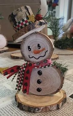 a snowman made out of wood sitting on top of a table