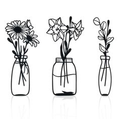 three glass vases with flowers in them