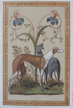 two dogs standing next to each other in front of a tree with flowers on it