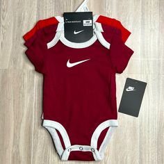 Nike Body Suit Infant 3 Months And 3 Piece Set Colors Are Red & Burgundy (Not Purple) Nike Fitted Sports Sets, Fitted Nike Sports Sets, Nike Fitted Sportswear Sets, Red Fitted Bodysuit For Casual Wear, Nike White Playtime Sets, Red Cotton Sports Set, Red Fitted Bodysuit For Playtime, Casual Red Cotton Bodysuit, Red Fitted Casual Onesie