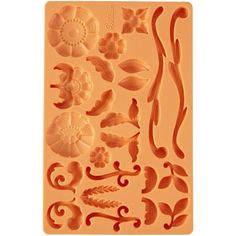 a cookie sheet with different shapes and designs on the front, including leaves and flowers